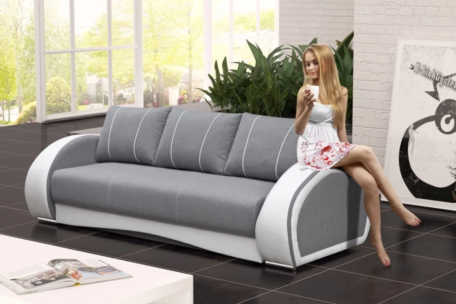 Elegantes graues Polstersofa mit weißen Elementen im Wohnbereich.
