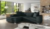 Dunkelgraues L-Form Sofa in einem lichtdurchfluteten Wohnzimmer mit Blick ins Grüne.