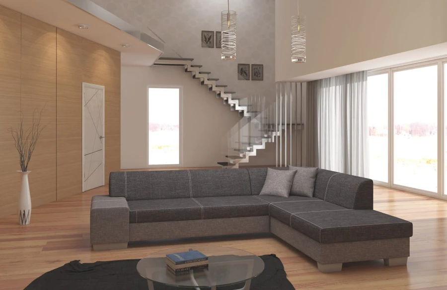 Graues Ecksofa in modernem Wohnzimmer mit Parkettboden und Glastreppe.