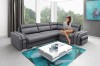 Graues Ecksofa in modernem Wohnzimmer mit Couchtisch und Teppich.